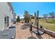 Charming backyard patio with a grill, outdoor seating, a heater, and an open green space at 634 Conover Rd, Durham, NC 27703