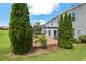 Backyard with a pergola, patio, and lush landscaping provide a cozy, private outdoor retreat at 634 Conover Rd, Durham, NC 27703