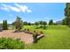 Beautiful backyard with a brick paver patio and a large grassy area, perfect for outdoor activities at 634 Conover Rd, Durham, NC 27703