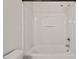 A clean, white bathtub and shower combination with simple, modern fixtures at 634 Conover Rd, Durham, NC 27703