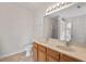 Well-lit bathroom featuring double sinks, framed mirror, and shower at 634 Conover Rd, Durham, NC 27703