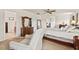 Spacious bedroom with a ceiling fan, chair, and dresser set with ample natural light at 634 Conover Rd, Durham, NC 27703