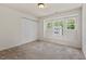 Comfortable bedroom with wide window offering an abundance of natural light at 634 Conover Rd, Durham, NC 27703