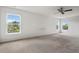Generously sized bedroom with ample light and neutral carpet, offering a peaceful retreat at 634 Conover Rd, Durham, NC 27703