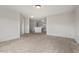 Large bedroom with a neutral palette, carpet floors, and a blank canvas for personalization at 634 Conover Rd, Durham, NC 27703
