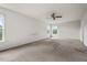 Sunlit bedroom featuring carpet, providing a warm and inviting space at 634 Conover Rd, Durham, NC 27703