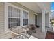 Cozy covered front porch with seating, creating an inviting outdoor space at 634 Conover Rd, Durham, NC 27703