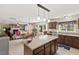 Open concept kitchen with island and stainless steel appliances flows into the dining and living areas at 634 Conover Rd, Durham, NC 27703