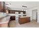 Fully equipped kitchen features an island, stainless appliances, and ample counter space at 634 Conover Rd, Durham, NC 27703
