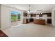 Spacious kitchen features ample counter space, stainless steel appliances, and access to the outdoor patio at 634 Conover Rd, Durham, NC 27703