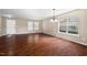 Open-concept living room featuring hardwood floors and ample natural light at 634 Conover Rd, Durham, NC 27703