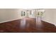 Bright living room with gleaming hardwood floors and abundant natural light at 634 Conover Rd, Durham, NC 27703