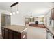 Open concept kitchen, dining, and living room with a fireplace and built in shelves at 634 Conover Rd, Durham, NC 27703