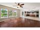 Inviting living space with wood floors and large windows overlooking a well-manicured backyard at 634 Conover Rd, Durham, NC 27703