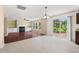 Open-concept living space blends wood and tile flooring and has access to the backyard patio at 634 Conover Rd, Durham, NC 27703