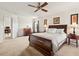 Spacious main bedroom with walk-in closet, carpet flooring, and neutral walls for relaxation at 634 Conover Rd, Durham, NC 27703