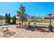 Brick patio features an outdoor table and seating area for relaxing and entertaining with a beautiful landscaped backyard at 634 Conover Rd, Durham, NC 27703