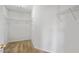 Functional walk-in closet with basic wire shelving for ample storage space at 634 Conover Rd, Durham, NC 27703