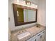 This updated bathroom features granite countertops and brushed nickel hardware at 6525 New Market Way, Raleigh, NC 27615