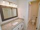 Bathroom featuring a granite vanity, updated fixtures, and a shower-tub combo in an efficient layout at 6525 New Market Way, Raleigh, NC 27615