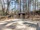 Spacious wooden back deck perfect for outdoor entertaining and relaxing in a serene, wooded setting at 7704 Cresthill Ct, Raleigh, NC 27615