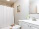 Clean bathroom featuring a shower-tub combination, white vanity, and modern fixtures at 7704 Cresthill Ct, Raleigh, NC 27615