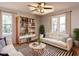 Inviting living room with a cozy sofa, stylish decor, and a large window for ample natural light at 7704 Cresthill Ct, Raleigh, NC 27615