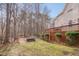 Private backyard offers a fire pit area, a bocce ball court and a hot tub for entertaining at 8015 Papaya Dr, Raleigh, NC 27613