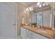 Bright bathroom with double sinks and tan granite countertops at 8015 Papaya Dr, Raleigh, NC 27613