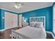 Bedroom featuring hardwood floors, closet, and a ceiling fan at 8015 Papaya Dr, Raleigh, NC 27613