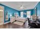 Bright bedroom with hardwood floors, ceiling fan, and natural light at 8015 Papaya Dr, Raleigh, NC 27613