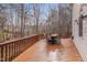 Enjoy outdoor dining on this wood deck with seating and wooded views at 8015 Papaya Dr, Raleigh, NC 27613