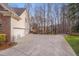 Wide driveway and attached two-car garage provide ample parking and convenience at 8015 Papaya Dr, Raleigh, NC 27613