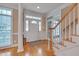 Welcoming foyer with hardwood floors, natural light, and traditional design elements at 8015 Papaya Dr, Raleigh, NC 27613