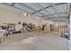 Spacious garage featuring ample storage, speckled flooring, and an automatic door at 8015 Papaya Dr, Raleigh, NC 27613