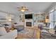 Comfortable living room with fireplace, built-in bookshelves, and stylish furnishings at 8015 Papaya Dr, Raleigh, NC 27613