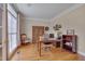Bright office space featuring hardwood floors, neutral walls, and ample natural light at 8015 Papaya Dr, Raleigh, NC 27613
