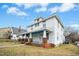 Classic two-story home with a welcoming front porch, enhanced by brick pillars and a well-maintained lawn at 802 N Elizabeth St, Durham, NC 27701