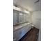 Spacious bathroom featuring dual sinks, granite countertops, modern fixtures, and a glass-enclosed shower at 81 Reece Dr, Sanford, NC 27332