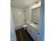 Bathroom featuring a tub and shower combo and a vanity with granite countertops at 81 Reece Dr, Sanford, NC 27332
