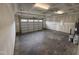 Spacious two-car garage featuring a large roll-up door and ample natural light at 81 Reece Dr, Sanford, NC 27332