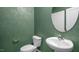 Stylish powder room with modern fixtures and elegant wallpaper at 817 Washington St, Fuquay Varina, NC 27526