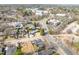 An aerial view of neighborhood homes, illustrating the peaceful residential setting near roadways and other businesses at 838 Woodburn Rd, Raleigh, NC 27605