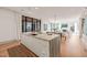 Open concept kitchen and dining area with a center island and modern design at 838 Woodburn Rd, Raleigh, NC 27605