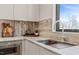 Bright kitchen featuring stainless steel appliances, sleek countertops, and a modern design at 838 Woodburn Rd, Raleigh, NC 27605