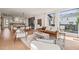 Open concept living room featuring a fireplace, comfortable seating, and natural light at 838 Woodburn Rd, Raleigh, NC 27605