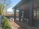 Screened-in patio with outdoor dining set, offering privacy and shade at 838 Woodburn Rd, Raleigh, NC 27605