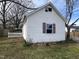 Charming home with white siding, and a white picket fence in a backyard with mature trees at 901 W Anderson St, Selma, NC 27576