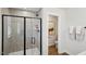 This gorgeous bathroom has a glass shower and a neutral color palette at 917 Montague Ave, Durham, NC 27703