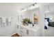 Bright bathroom features double vanity with quartz countertop and modern black fixtures at 917 Montague Ave, Durham, NC 27703